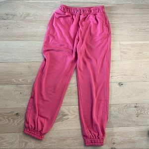 Pink sweatpants.